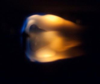 Image of a flame burning one of the BASS tests on extinguishing burning fuels.