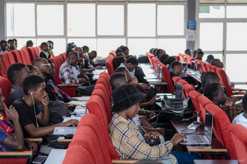 Students at a NASA Space Apps event working on computers